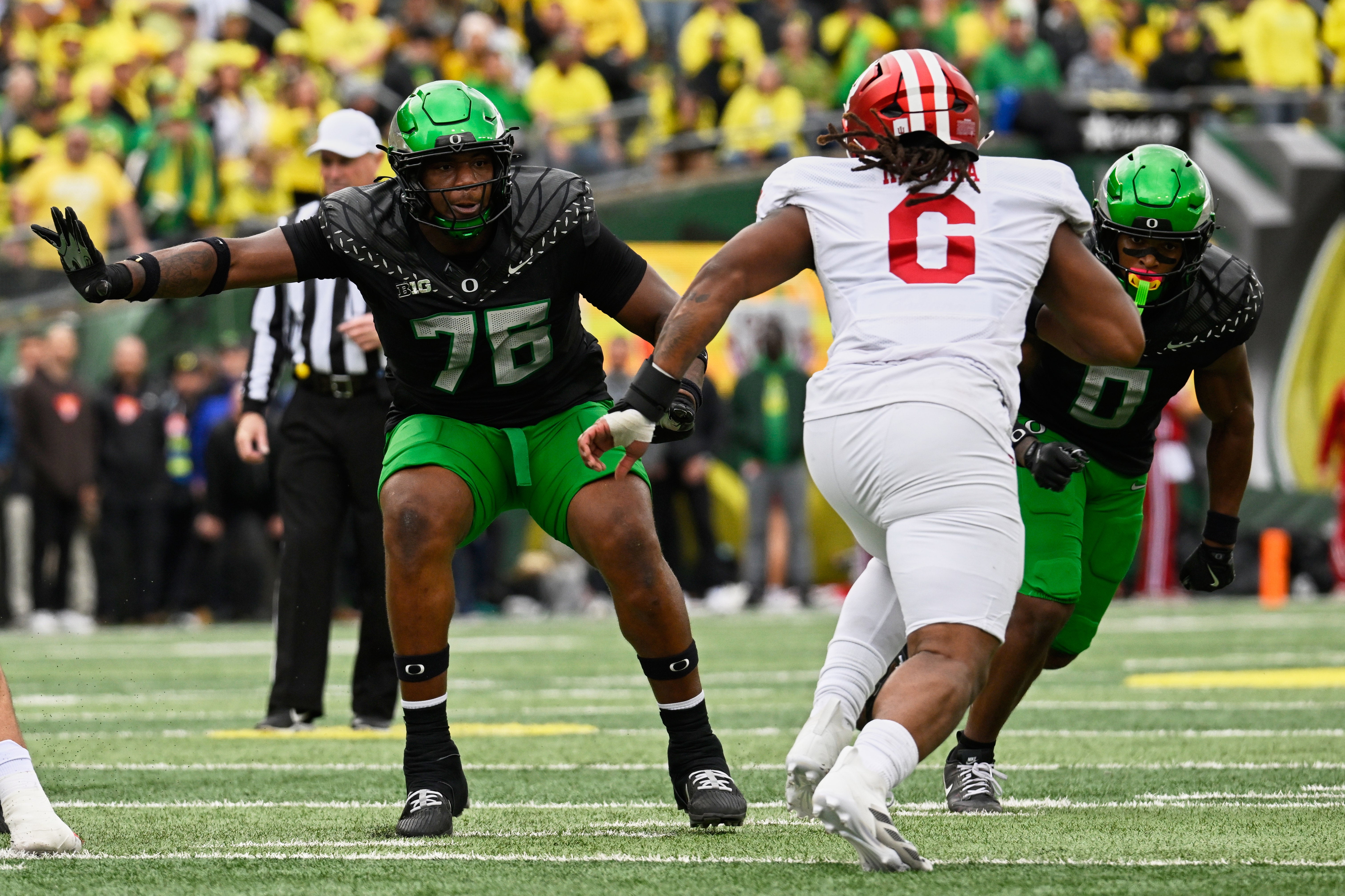 Oct 11, 2025; Eugene, Oregon, USA; Oregon Ducks offensive lineman Isaiah World (76) and defensive back Daylen Austin (0) block against Indiana Hoosiers defensive lineman Mikail Kamara (6) during the second quarter at Autzen Stadium.