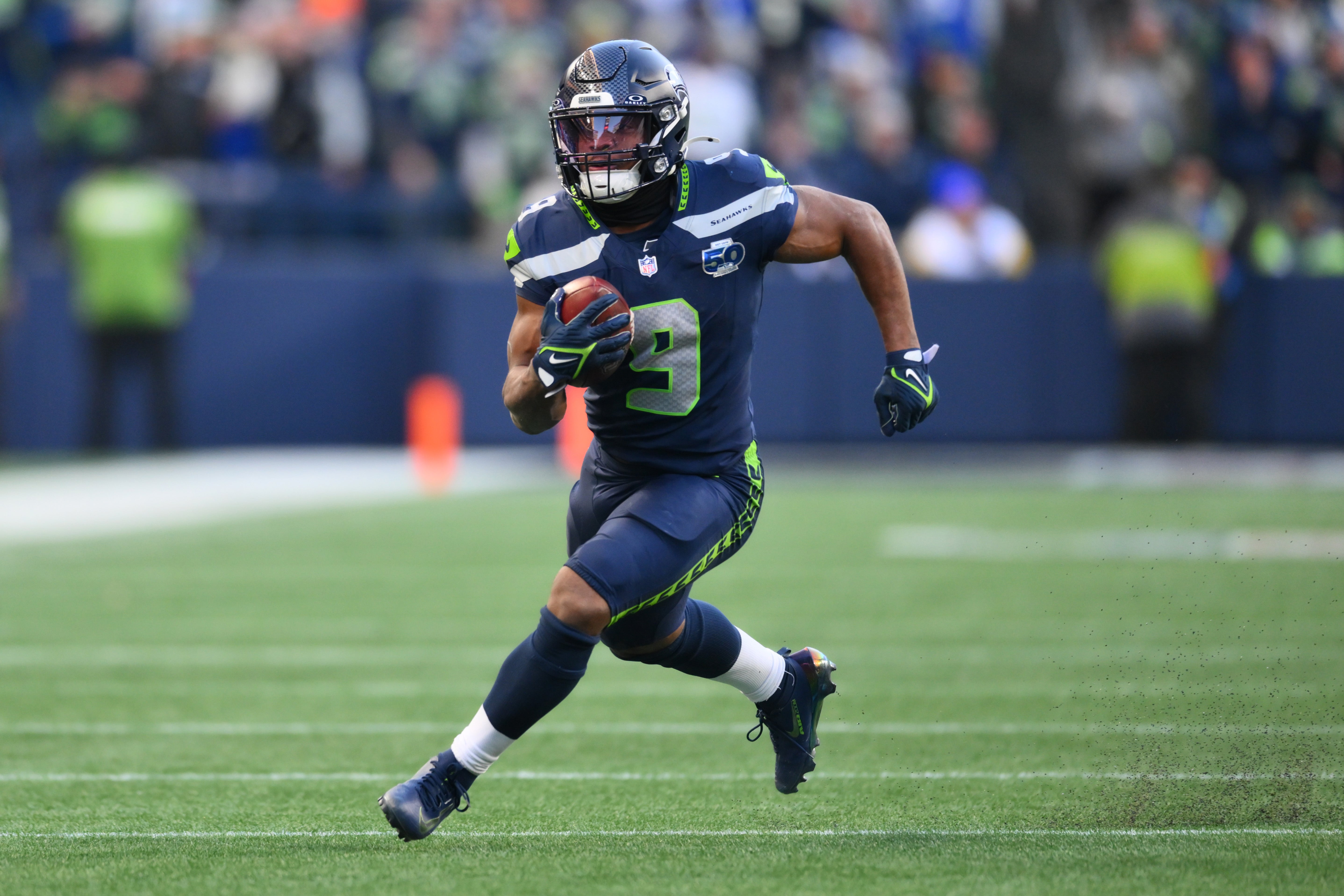 Jan 25, 2026; Seattle, WA, USA; Seattle Seahawks running back Kenneth Walker III (9) runs against the Los Angeles Rams in the first half in the 2026 NFC Championship Game at Lumen Field. 