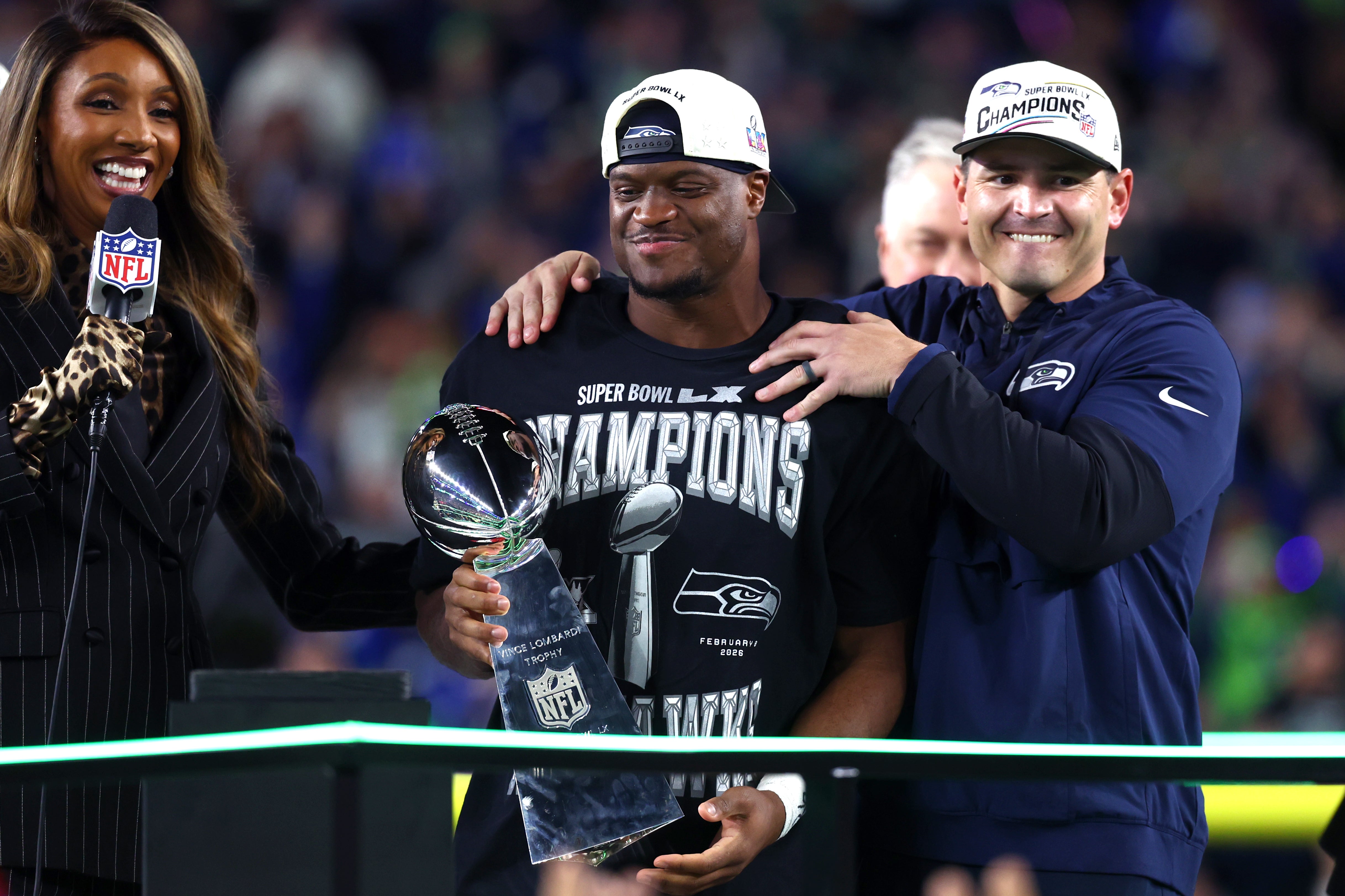 Feb 8, 2026; Santa Clara, CA, USA; Seattle Seahawks head coach Mike MacDonald and running back Kenneth Walker III (9) celebrate with the Vince Lombardi trophy after defeating the New England Patriots in Super Bowl LX at Levi's Stadium.