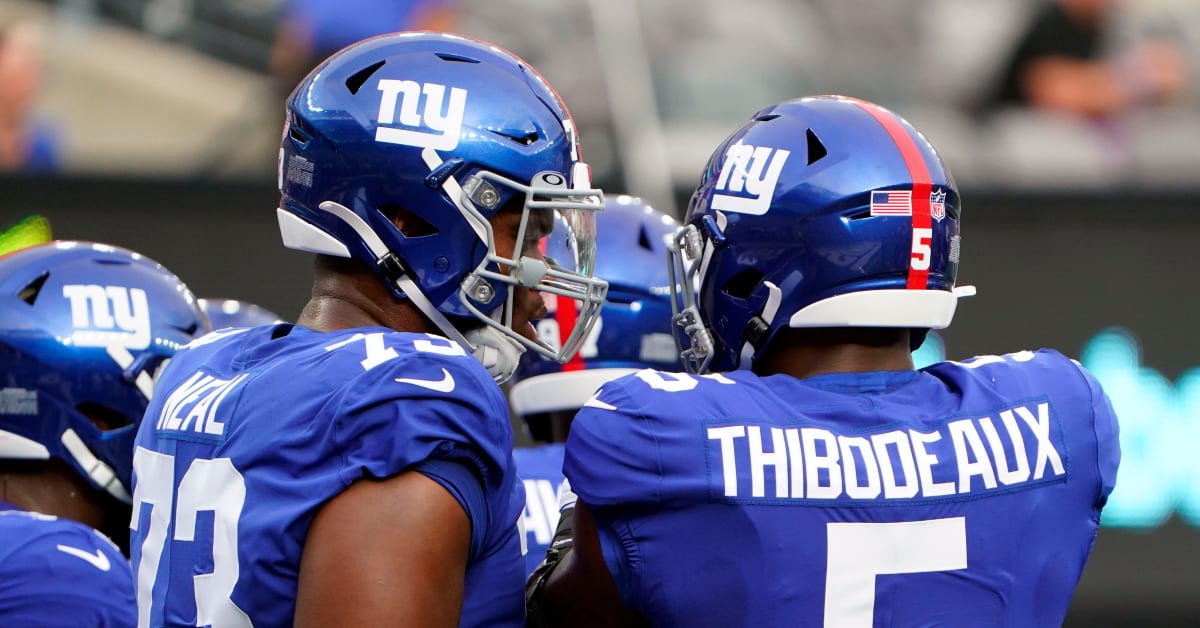 New York Giants tackle Evan Neal #73 walks off the field after their 31-27  loss to the New York Jets in an NFL pre-season football game, Sunday, Aug.  27, 2022, in East