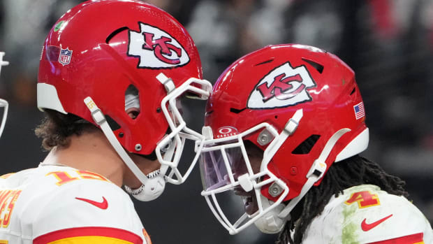 Chiefs wide receiver Rashee Rice (4) celebrates with quarterback Patrick Mahomes (15) after a touchdown against the Las Vegas Raiders in the second half at Allegiant Stadium.