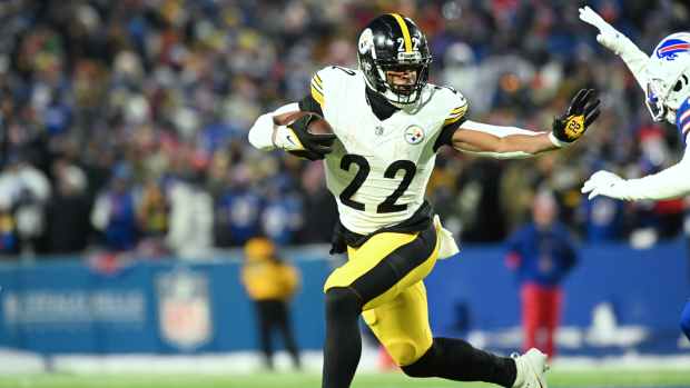 Jan 15, 2024; Orchard Park, New York, USA; Pittsburgh Steelers running back Najee Harris (22) runs the ball in the first half against the Buffalo Bills in a 2024 AFC wild card game at Highmark Stadium. Mandatory Credit: Mark Konezny-USA TODAY Sports  