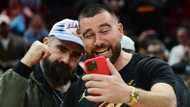 Mar 5, 2024; Cleveland, Ohio, USA; Cleveland natives and NFL players Travis, right, and Jason Kelce celebrate after the Cleveland Cavaliers beat the Boston Celtics during the second half at Rocket Mortgage FieldHouse. 