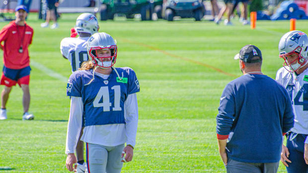 New England Patriots safety Brenden Schooler (41) reacts against