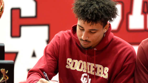 Carl Albert's Trynae Washington signs with the University of Oklahoma during a signing day ceremony at Carl Albert High School in Midwest City, Okla., Wednesday, Dec., 4, 2024.