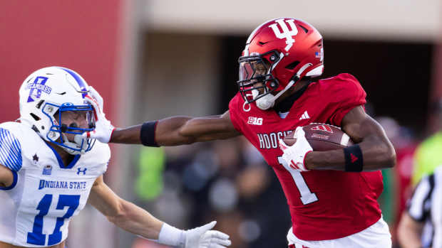 Sep 8, 2023; Bloomington, Indiana, USA; Indiana Hoosiers wide receiver Donaven McCulley (1) runs the ball while Indiana State Sycamores defensive back Maddix Blackwell (17) defends in the first half at Memorial Stadium. 