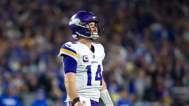 Minnesota Vikings quarterback Sam Darnold (14) reacts against the Los Angeles Rams in the second half during an NFC wild card game at State Farm Stadium.