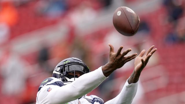 Seattle Seahawks wide receiver DK Metcalf (14) warms up before an