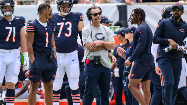 Chicago Bears quarterback Nathan Peterman (14) scrambles under pressure  from Tennessee Titans linebacker Thomas Rush (48) during the second half of  an NFL preseason football game, Saturday, Aug. 12, 2023, in Chicago. (