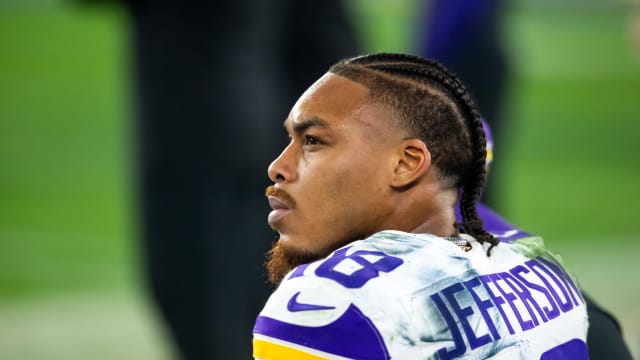 Jan 13, 2025; Glendale, AZ, USA; Minnesota Vikings wide receiver Justin Jefferson (18) against the Los Angeles Rams during an NFC wild card game at State Farm Stadium.