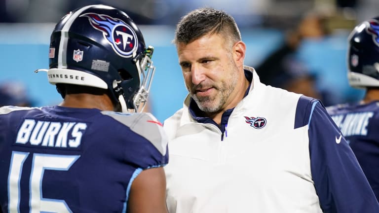 Tennessee Titans wide receiver D.J. Woods (12) works out before