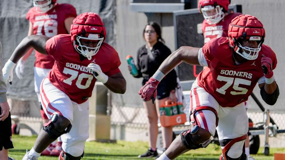 Ryan Fodje (70) and Daniel Akinkunmi (75) runs drills during an Oklahoma (OU) football practice at the Gaylord Family Oklahoma Memorial Stadium in Norman, Okla., on Tuesday, March 25, 2025.