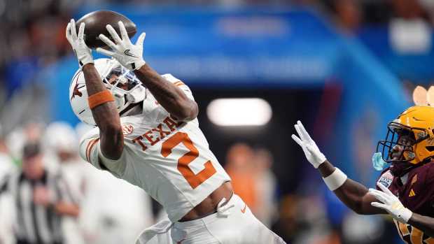 Jan 1, 2025; Atlanta, GA, USA; Texas Longhorns wide receiver Matthew Golden (2) makes a catch against the Arizona State Sun Devils during the second half of the Peach Bowl at Mercedes-Benz Stadium.