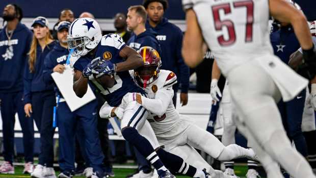 Dallas Cowboys wide receiver Michael Gallup (13) and Washington Commanders cornerback Benjamin St-Juste (25) in action during the game between the Dallas Cowboys and the Washington Commanders at AT&T Stadium.