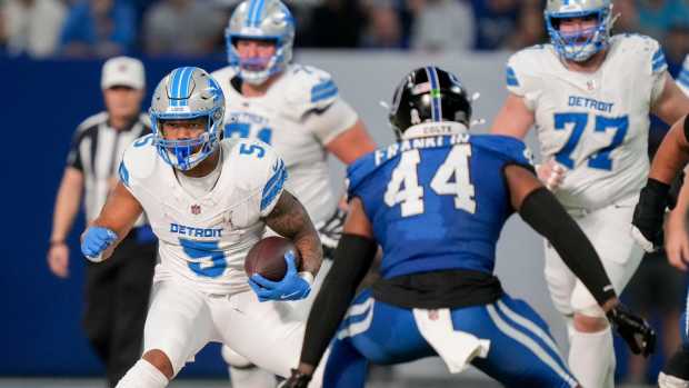 Detroit Lions running back David Montgomery (5) looks to move past Indianapolis Colts linebacker Zaire Franklin (44) on Sunday, Nov. 24, 2024, during a game at Lucas Oil Stadium in Indianapolis.