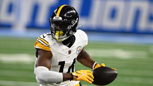 Pittsburgh Steelers wide receiver George Pickens (14) runs upfield after catching a pass against the Detroit Lions in the first quarter at Ford Field.