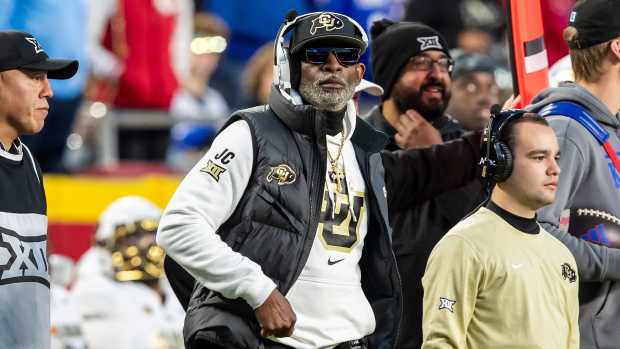Nov 23, 2024; Kansas City, Missouri, USA; Colorado head coach Deion Sanders watches the run of play during the 3rd quarter between the Kansas Jayhawks and the Colorado Buffaloes at GEHA Field at Arrowhead Stadium.