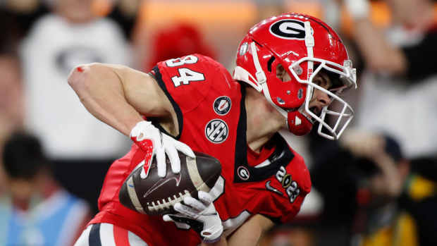 Georgia wide receiver Ladd McConkey (84) scores a touchdown during the first half of the NCAA College Football National Championship game between TCU and Georgia on Monday, Jan. 9, 2023, in Inglewood.