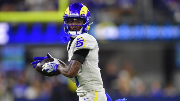 Los Angeles Rams wide receiver Tutu Atwell (5) runs the ball after catching a pass against the Minnesota Vikings during the second half at SoFi Stadium. 