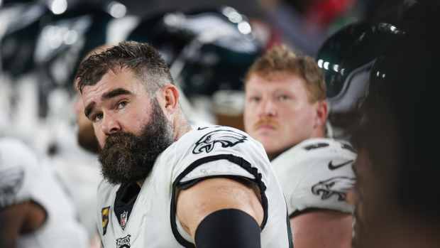 Philadelphia Eagles center Jason Kelce (62) looks on from the sideline during the first half of a 2024 NFC wild card game against the Tampa Bay Buccaneers at Raymond James Stadium.