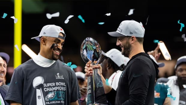 Philadelphia Eagles quarterback Jalen Hurts (left) and head coach Nick Sirianni celebrate with the Vince Lombardi Trophy after defeating the Kansas City Chiefs during Super Bowl LIX at Ceasars Superdome.