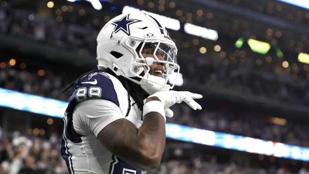 Dallas Cowboys wide receiver CeeDee Lamb (88) reacts after scoring a touchdown against the Cincinnati Bengals in the first quarter at AT&T Stadium.