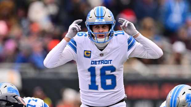 Dec 22, 2024; Chicago, Illinois, USA; Detroit Lions quarterback Jared Goff (16) signals at the line against the Chicago Bears during the second quarter at Soldier Field.