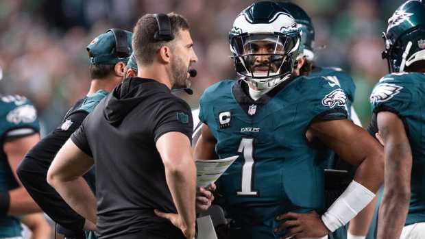 Sep 16, 2024; Philadelphia, Pennsylvania, USA; Philadelphia Eagles quarterback Jalen Hurts (1) talks with head coach Nick Sirianni during a timeout in the first quarter against the Atlanta Falcons at Lincoln Financial Field.