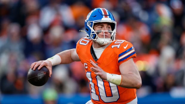 Jan 5, 2025; Denver, Colorado, USA; Denver Broncos quarterback Bo Nix (10) looks to pass in the third quarter against the Kansas City Chiefs at Empower Field at Mile High.