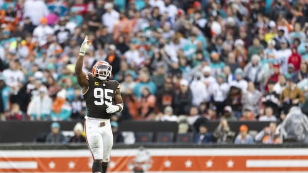 Cleveland Browns defensive end Myles Garrett (95) celebrates his sack against the Miami Dolphins during the first quarter at Huntington Bank Field.