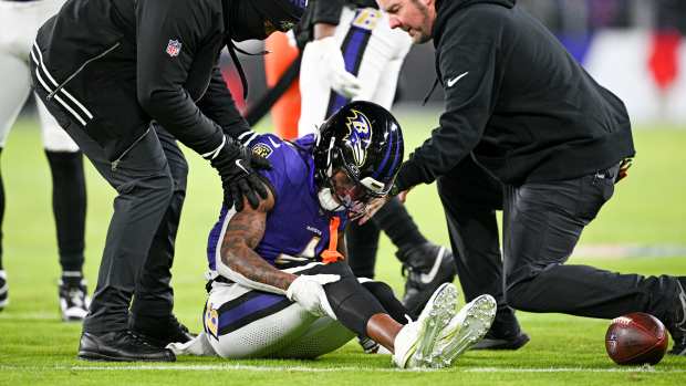 Jan 4, 2025; Baltimore, Maryland, USA; Baltimore Ravens wide receiver Zay Flowers (4) reacts after a tackle during the first quarter against the Cleveland Browns at M&T Bank Stadium.