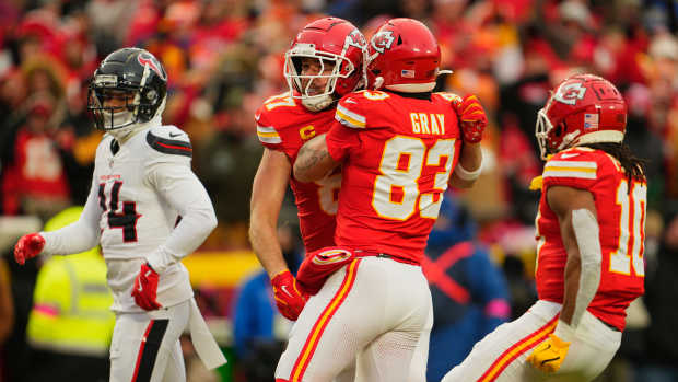 Jan 18, 2025; Kansas City, Missouri, USA; Kansas City Chiefs tight end Travis Kelce (87) celebrates with tight end Noah Gray (83) after making a long pass reception against the Houston Texans during the second quarter of a 2025 AFC divisional round game at GEHA Field at Arrowhead Stadium.