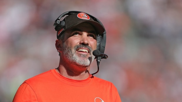 Cleveland Browns head coach Kevin Stefanski is all smiles as he watches running back Nick Chubb score a touchdown during the first half of an NFL football game at Huntington Bank Field