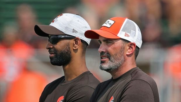 Browns GM Andrew Berry, left, and coach Kevin Stefanski watch practice in training camp, Saturday, July 31, 2021, in Berea