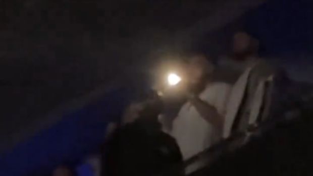 Travis Kelce was caught filming Taylor Swift with his flash on while at her latest Eras Tour show