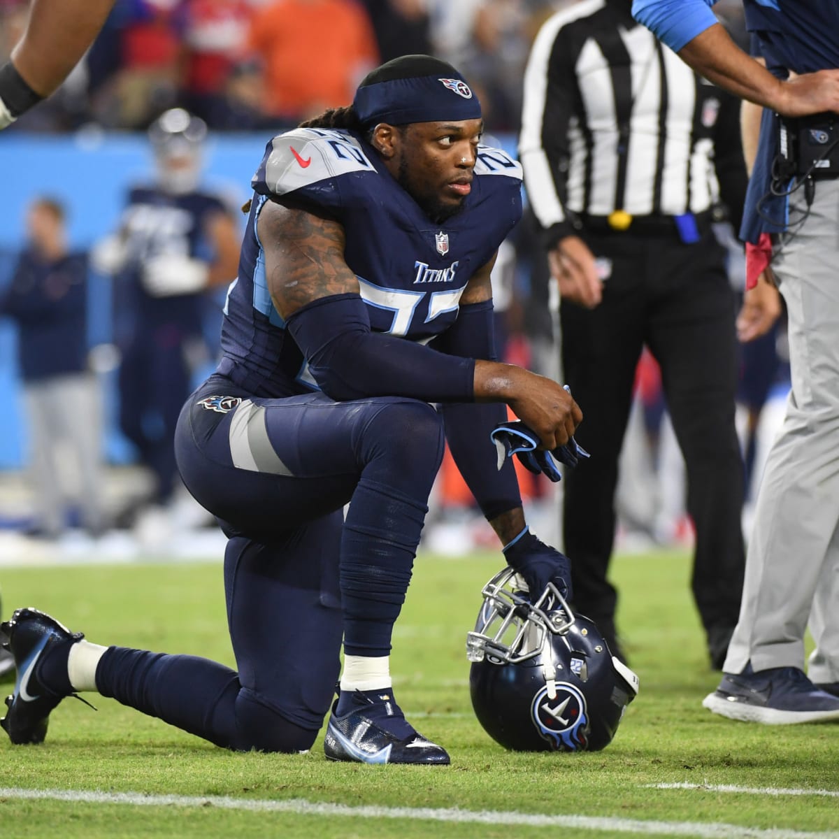 Nashville, United States. 22nd Jan, 2022. Tennessee Titans running back  Derrick Henry (22), who is returning after an extended absence because of  an injury, enters the field before an NFL Divisional Playoff