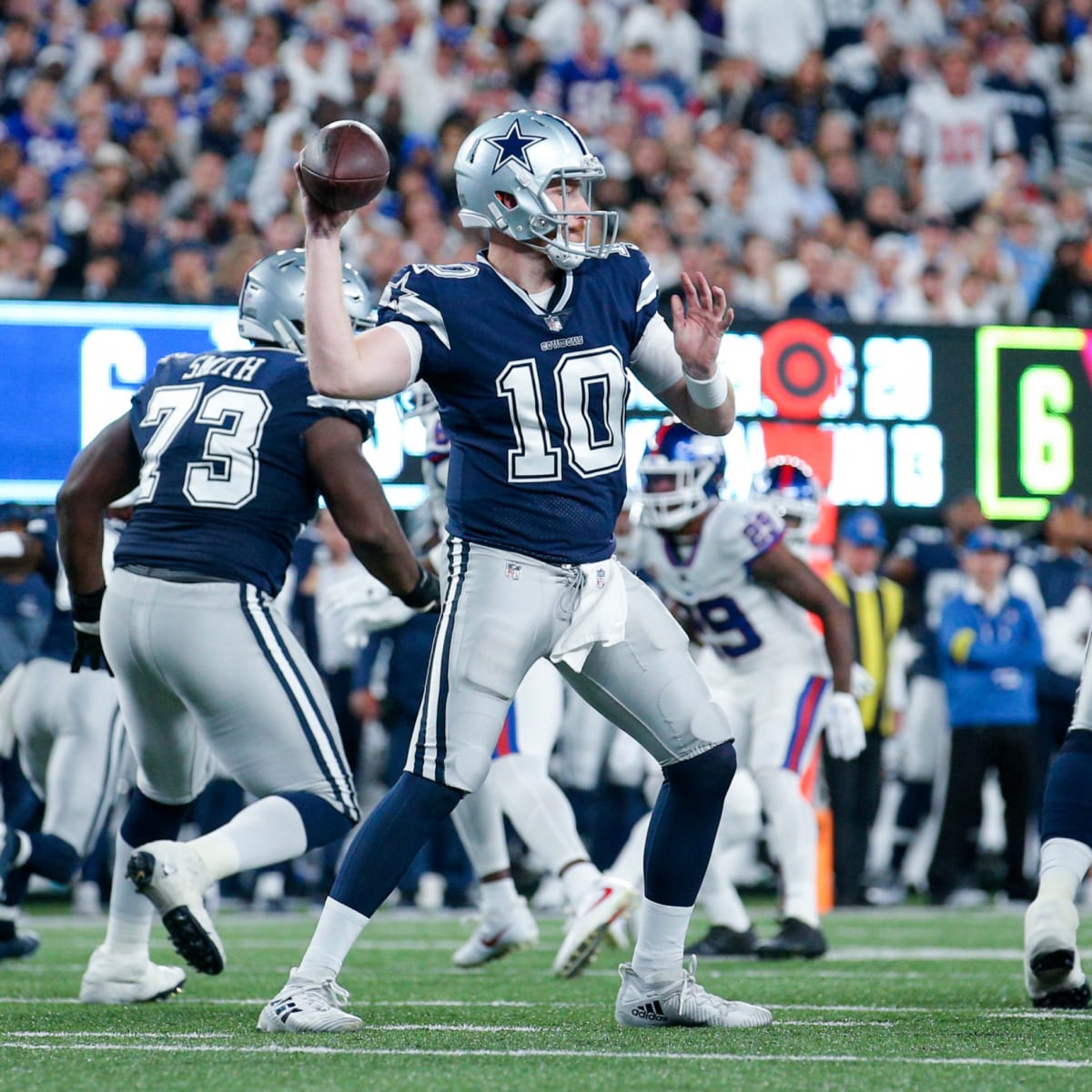 Dallas Cowboys quarterback Cooper Rush warms up before the game