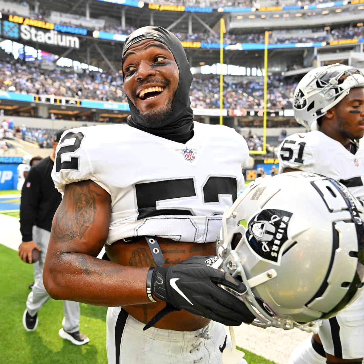 Las Vegas Raiders safety Duron Harmon celebrates his interception during an  NFL football game against the Seattle Seahawks, Sunday, Nov. 27, 2022, in  Seattle.The Raiders won 40-34 in overtime. (AP Photo/Caean Couto