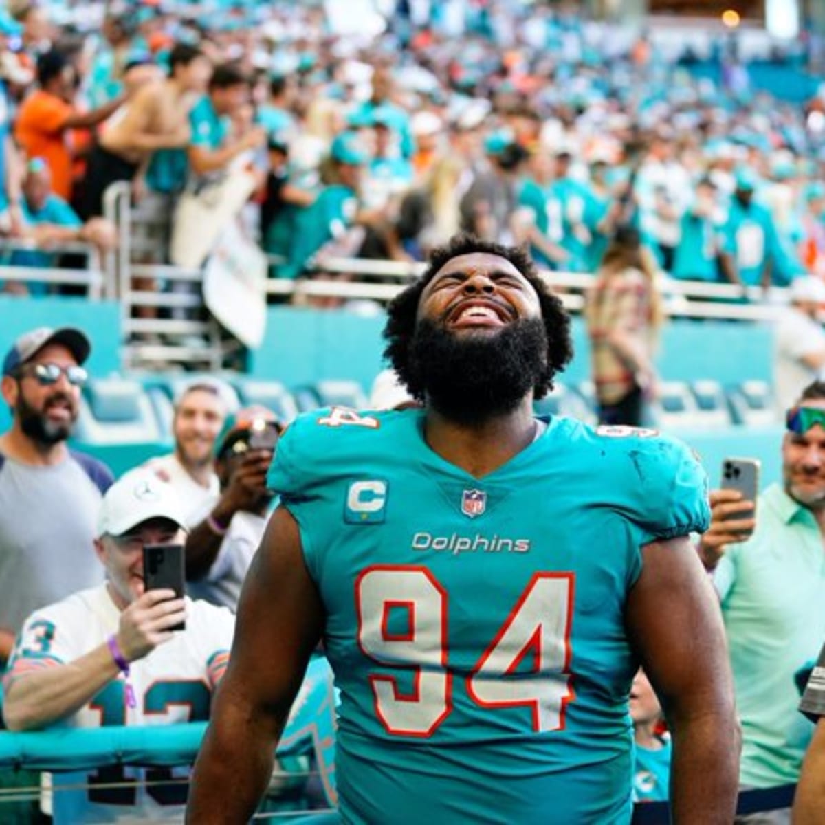 Miami Dolphins defensive tackle Christian Wilkins (94) runs onto the field  before an NFL football game against the Houston Texans, Sunday, Nov. 27,  2022, in Miami Gardens, Fla. (AP Photo/Doug Murray Stock