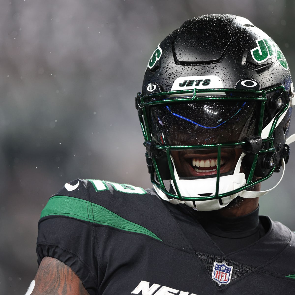 New York Jets running back Michael Carter (32) warms up before taking on  the Miami Dolphins during an NFL football game Sunday, Oct. 9, 2022, in  East Rutherford, N.J. (AP Photo/Adam Hunger