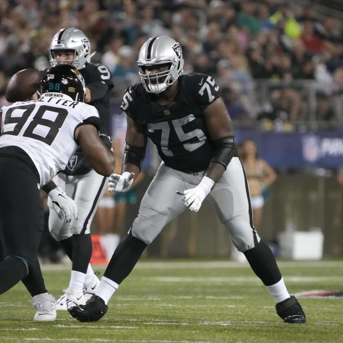 Oakland Raiders offensive tackle Brandon Parker (75) watches