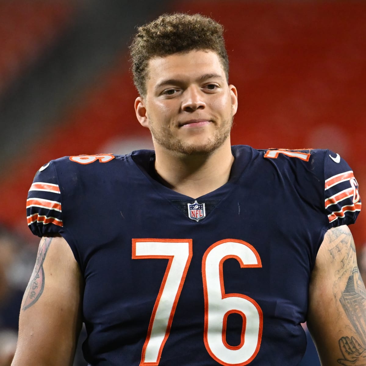 Chicago Bears offensive tackle Teven Jenkins (76) runs off the field after  an NFL football game