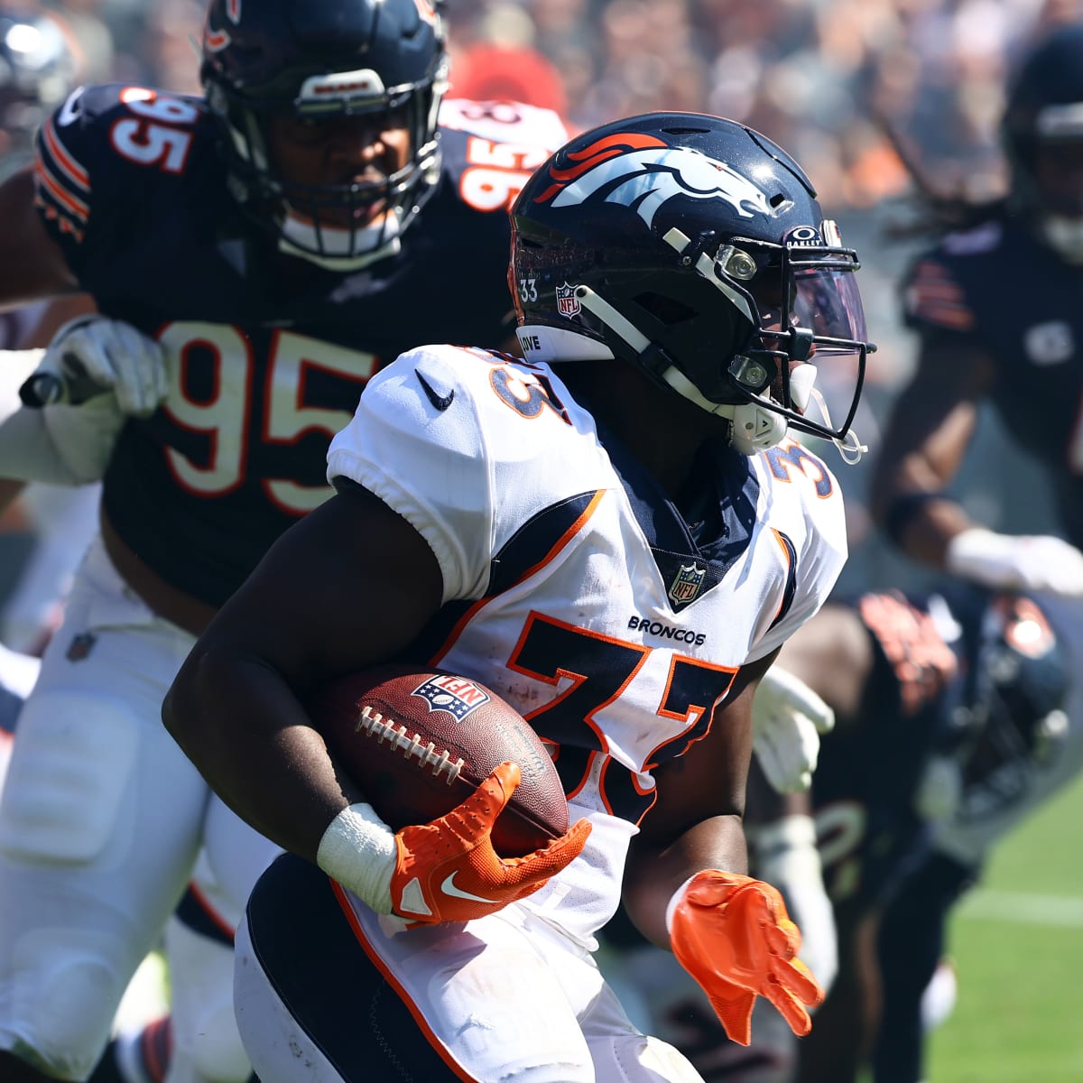 Javonte Williams of the Denver Broncos plays against the Cleveland