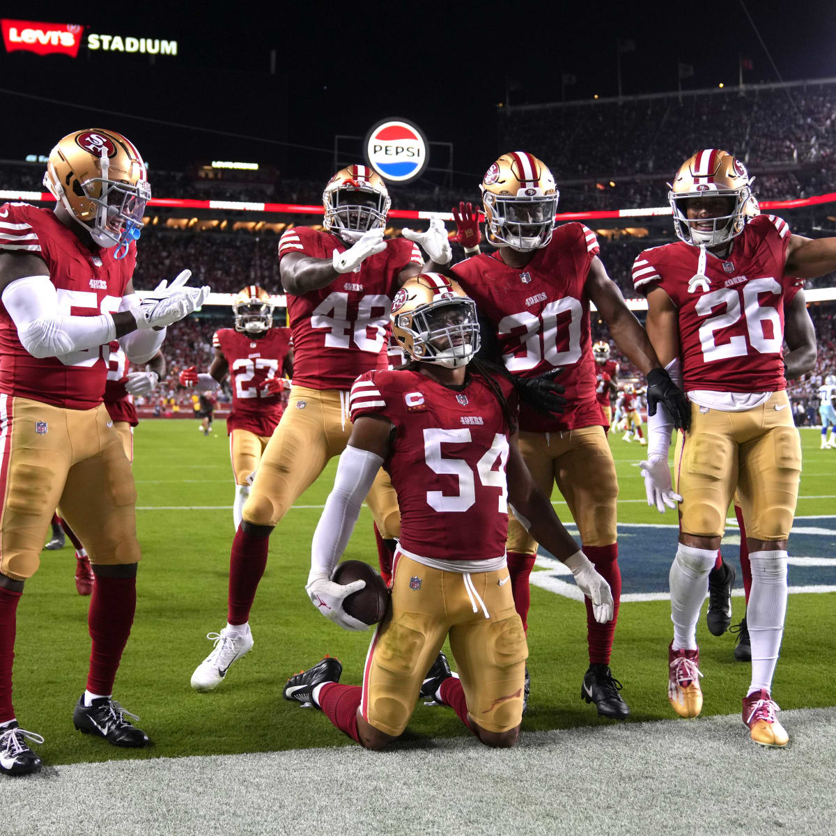 San Francisco 49ers' Fred Warner (54) and teammates celebrate his  interception against the Kans …