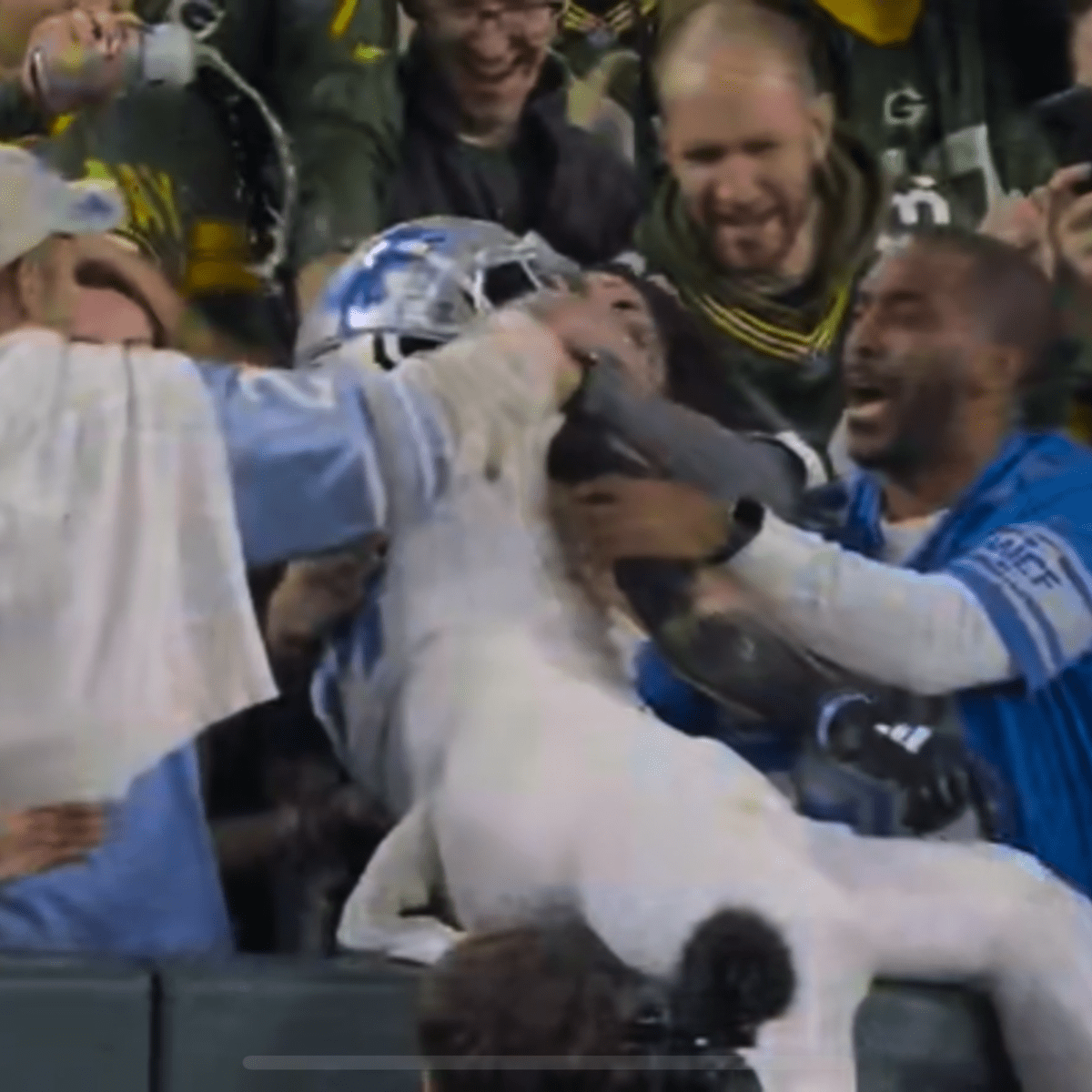 Packers fan showers Amon-Ra St. Brown with beer during TD celebration