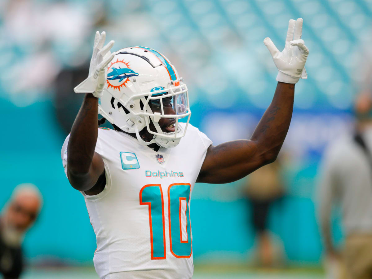 Miami Dolphins wide receiver Tyreek Hill (10) reacts as he is introduced  before the first half of an NFL football game against the New York Jets,  Sunday, Jan. 8, 2023, in Miami