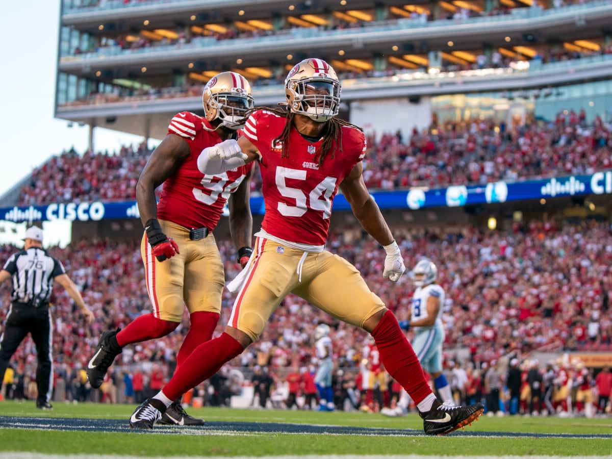 San Francisco 49ers' Bryant Young celebrates a sack against the