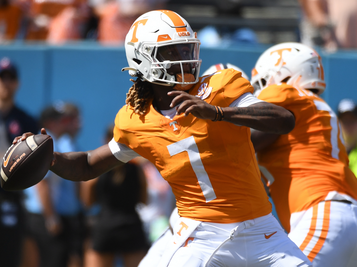 Tennessee quarterback throws orange length of football field.