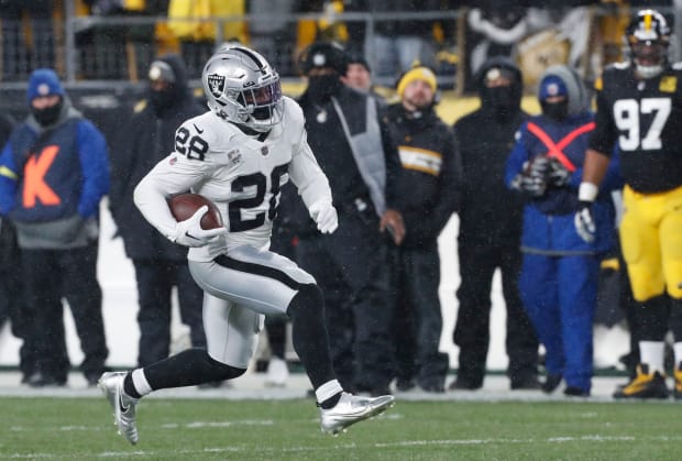 Josh Jacobs Returns To Raiders, Hugs GM Dave Ziegler, Changes Jersey Number