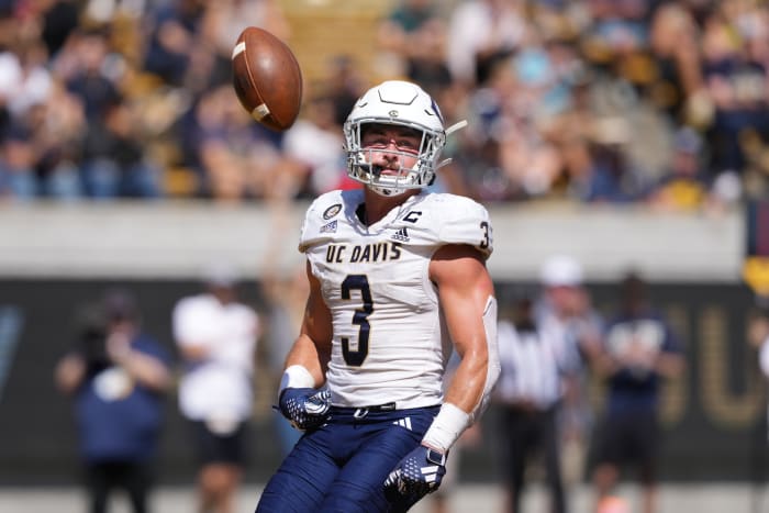 UC Davis Aggies running back Lan Larison (3) flips the ball into the air after scoring a touchdown against the California Golden Bears during the second quarter at California Memorial Stadium.